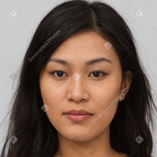 Joyful asian young-adult female with long  brown hair and brown eyes