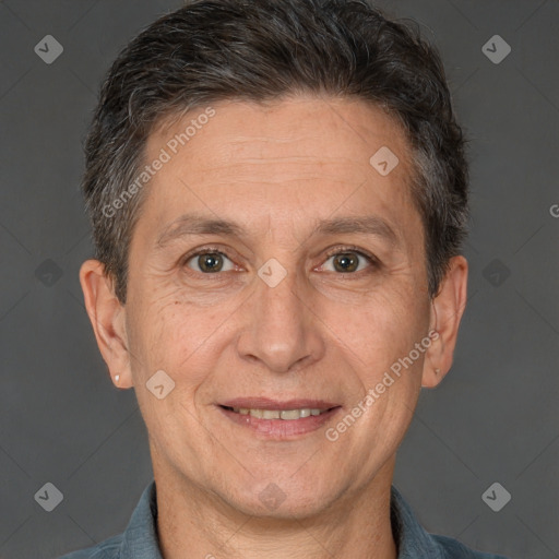 Joyful white adult male with short  brown hair and brown eyes