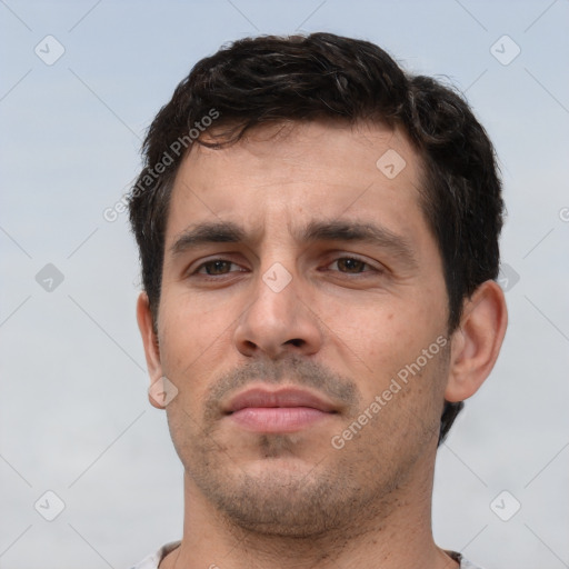 Neutral white young-adult male with short  brown hair and brown eyes