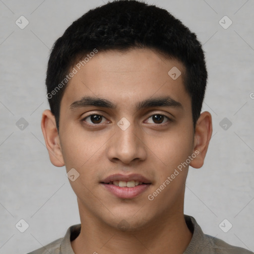 Joyful white young-adult male with short  black hair and brown eyes