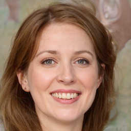 Joyful white adult female with medium  brown hair and grey eyes