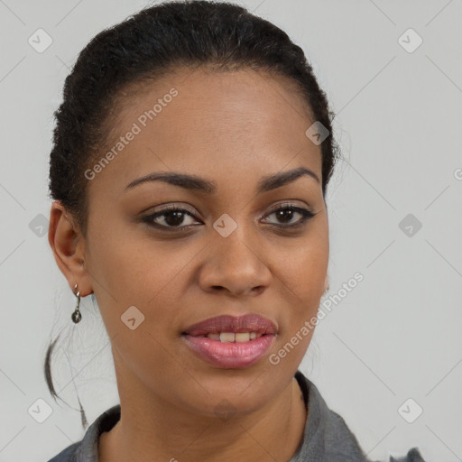 Joyful black young-adult female with short  brown hair and brown eyes