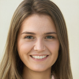 Joyful white young-adult female with long  brown hair and green eyes