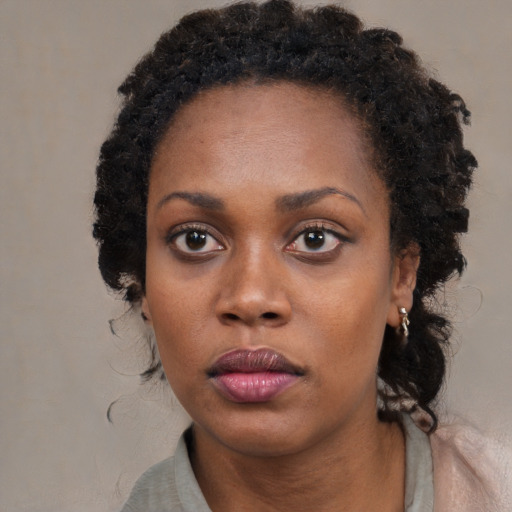 Neutral black young-adult female with long  black hair and brown eyes