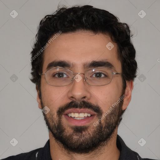 Joyful white young-adult male with short  black hair and brown eyes