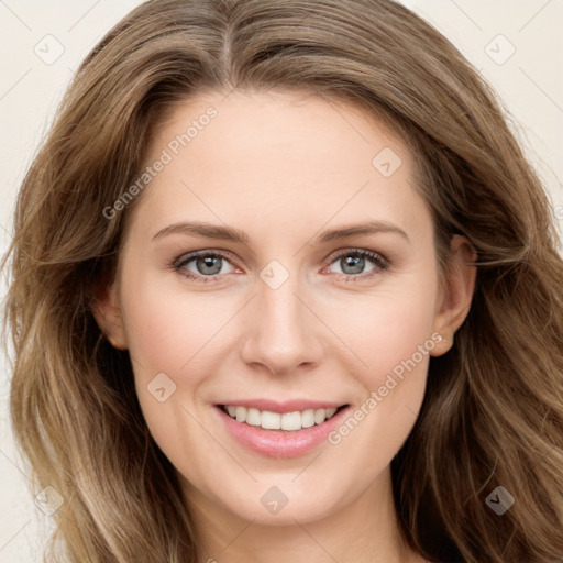 Joyful white young-adult female with long  brown hair and blue eyes