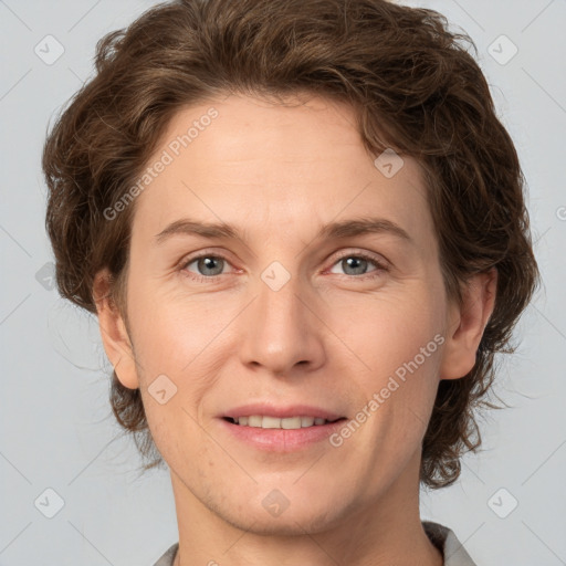 Joyful white adult female with short  brown hair and grey eyes