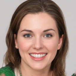 Joyful white young-adult female with medium  brown hair and green eyes