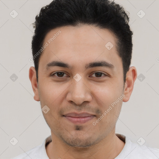 Joyful white young-adult male with short  black hair and brown eyes