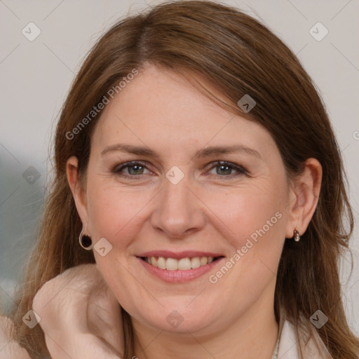 Joyful white adult female with long  brown hair and brown eyes