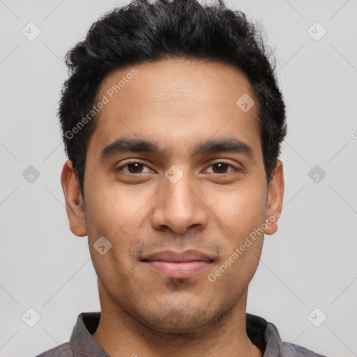 Joyful latino young-adult male with short  black hair and brown eyes