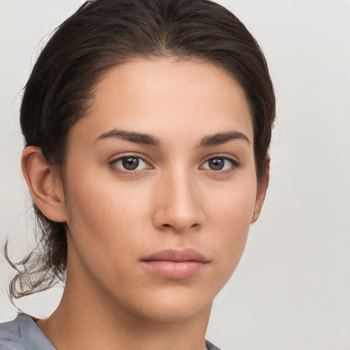 Neutral white young-adult female with medium  brown hair and brown eyes