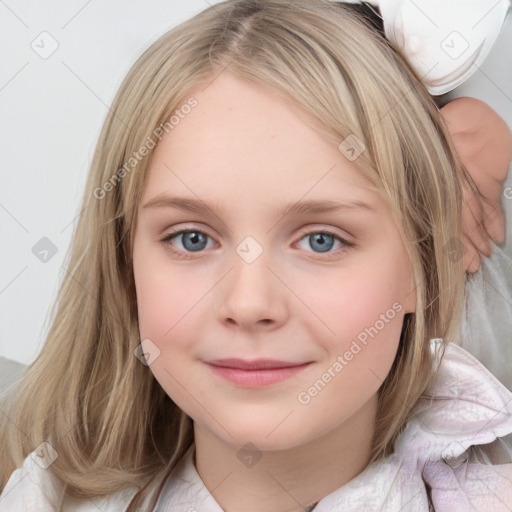 Joyful white child female with medium  brown hair and blue eyes