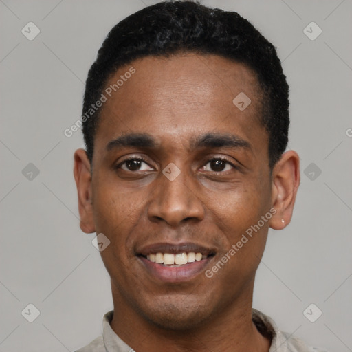 Joyful black young-adult male with short  black hair and brown eyes