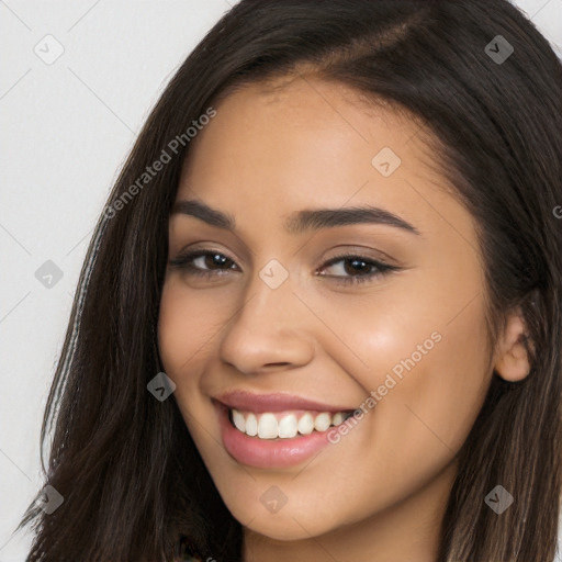 Joyful latino young-adult female with long  brown hair and brown eyes