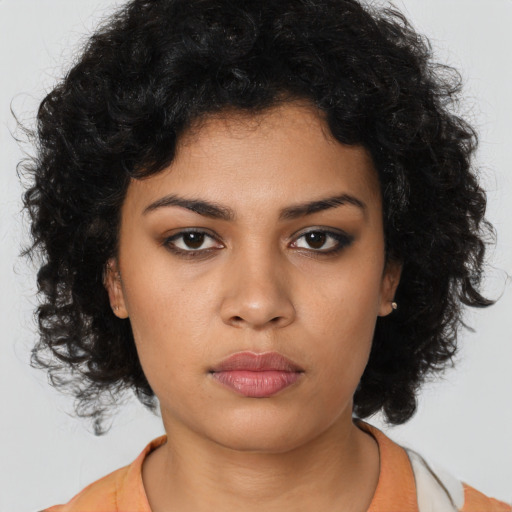 Neutral latino young-adult female with long  black hair and brown eyes