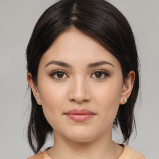 Joyful white young-adult female with medium  brown hair and brown eyes