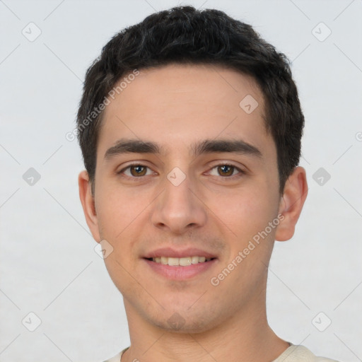 Joyful white young-adult male with short  black hair and brown eyes