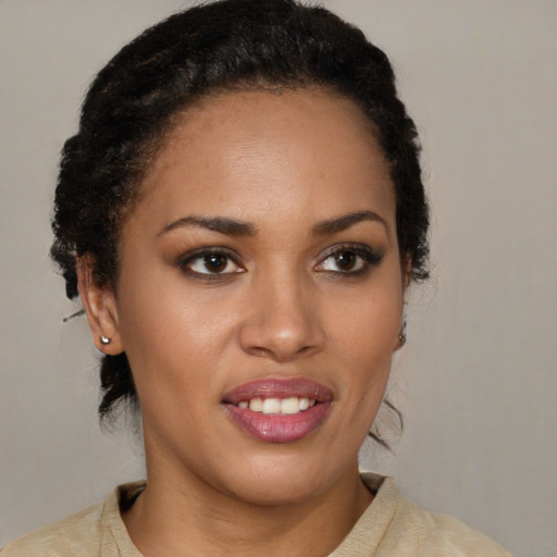 Joyful latino young-adult female with short  brown hair and brown eyes