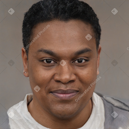 Joyful black young-adult male with short  brown hair and brown eyes