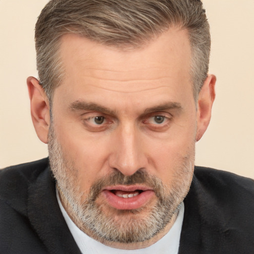 Joyful white middle-aged male with short  brown hair and brown eyes