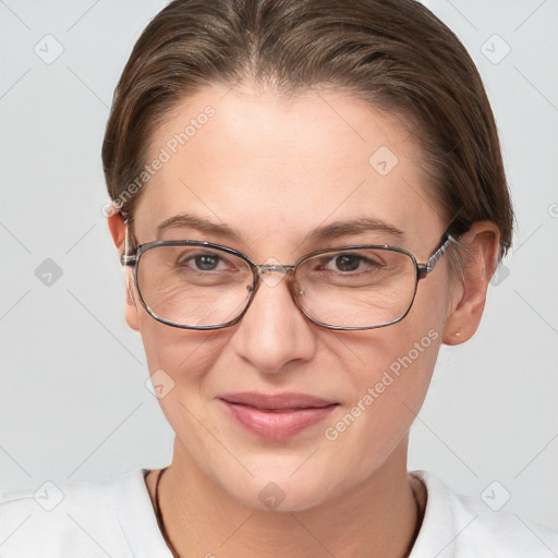 Joyful white adult female with short  brown hair and brown eyes