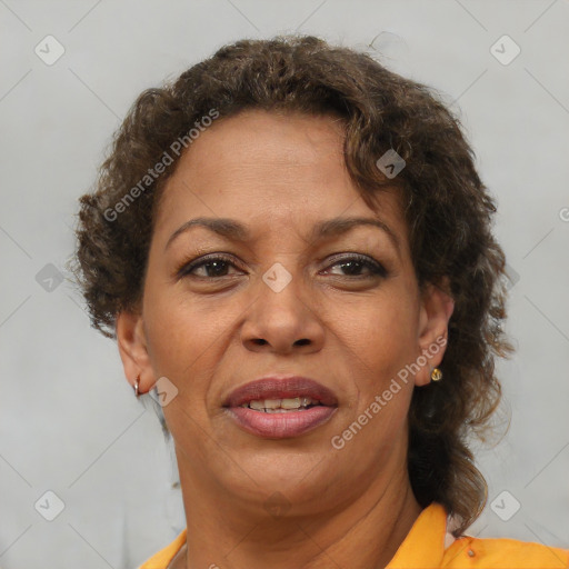 Joyful black adult female with short  brown hair and brown eyes