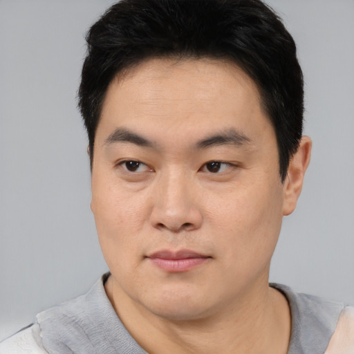 Neutral asian young-adult male with short  black hair and brown eyes