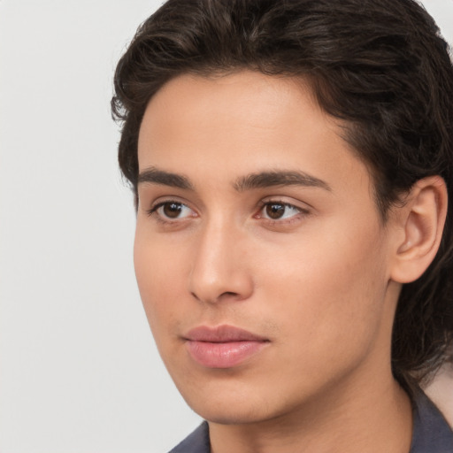 Neutral white young-adult male with long  brown hair and brown eyes