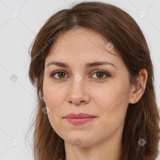 Joyful white adult female with long  brown hair and brown eyes