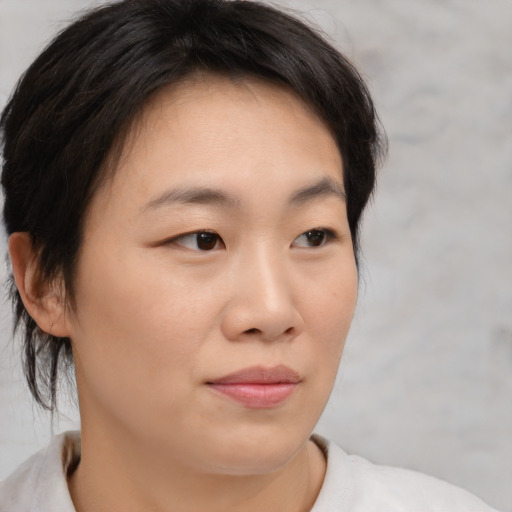 Neutral asian young-adult female with medium  brown hair and brown eyes