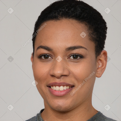 Joyful latino young-adult female with short  black hair and brown eyes