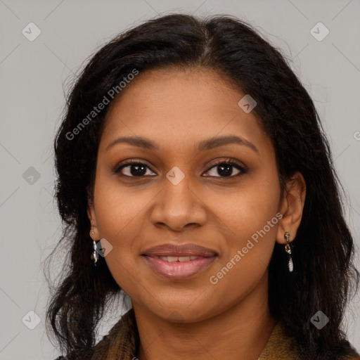 Joyful black young-adult female with long  brown hair and brown eyes