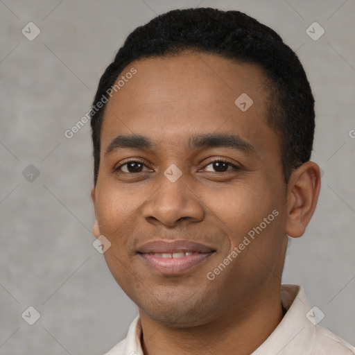 Joyful latino young-adult male with short  black hair and brown eyes