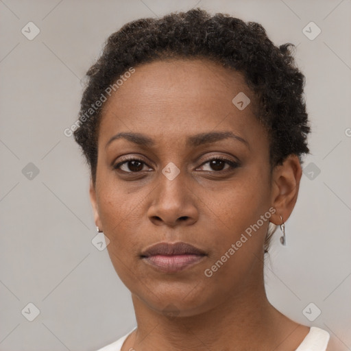 Neutral black young-adult female with short  brown hair and brown eyes