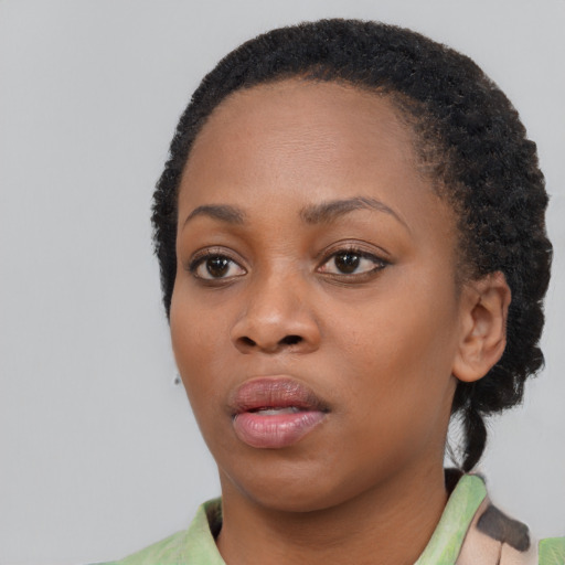 Neutral black young-adult female with short  black hair and brown eyes