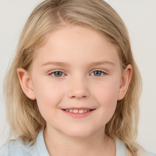 Joyful white child female with medium  brown hair and blue eyes