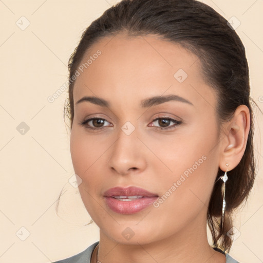 Joyful white young-adult female with long  brown hair and brown eyes