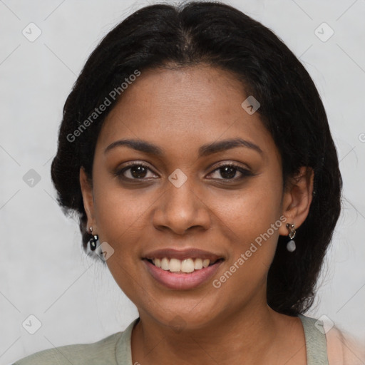 Joyful black young-adult female with medium  black hair and brown eyes