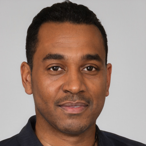 Neutral black young-adult male with short  black hair and brown eyes