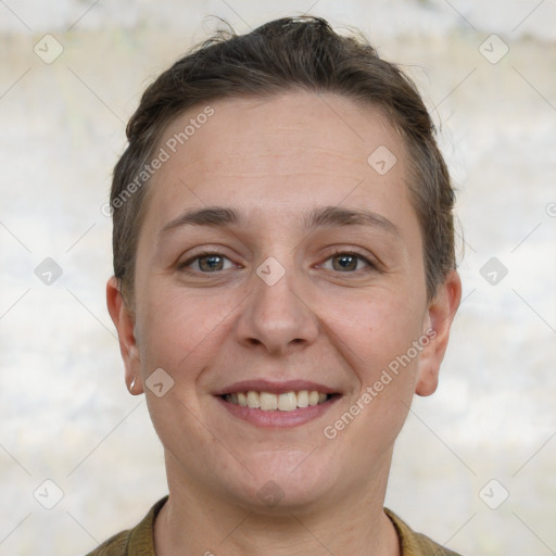 Joyful white adult female with short  brown hair and grey eyes