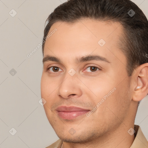 Joyful white young-adult male with short  brown hair and brown eyes