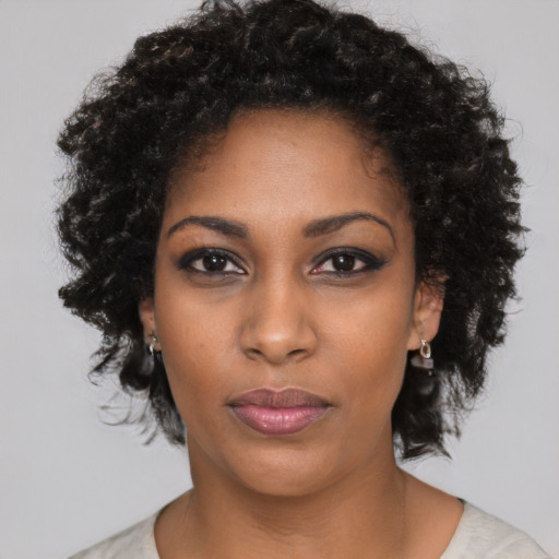 Neutral black young-adult female with medium  black hair and brown eyes