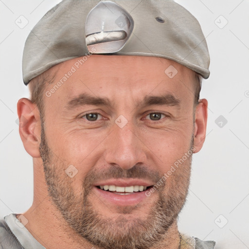 Joyful white adult male with short  brown hair and grey eyes