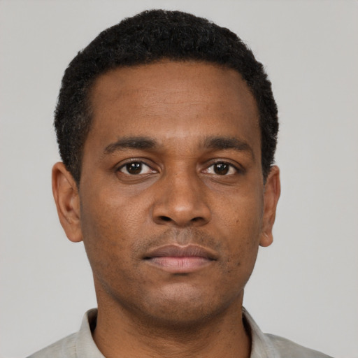 Neutral black young-adult male with short  black hair and brown eyes