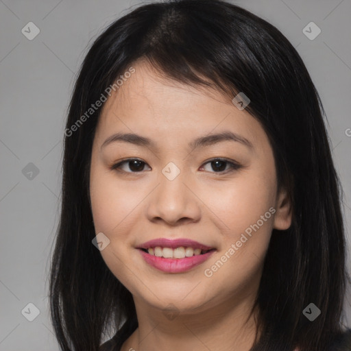 Joyful asian young-adult female with long  brown hair and brown eyes