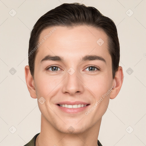 Joyful white young-adult male with short  brown hair and grey eyes