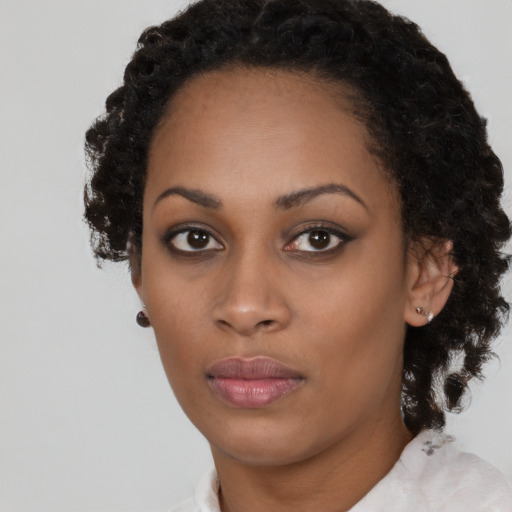 Neutral black young-adult female with short  black hair and brown eyes