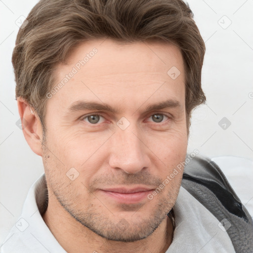 Joyful white adult male with short  brown hair and grey eyes