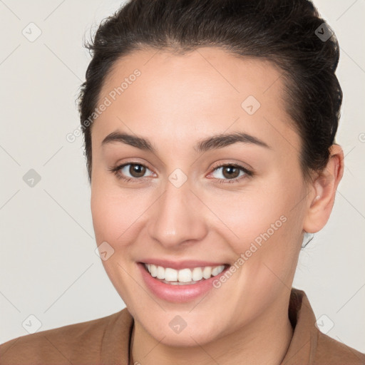 Joyful white young-adult female with short  brown hair and brown eyes